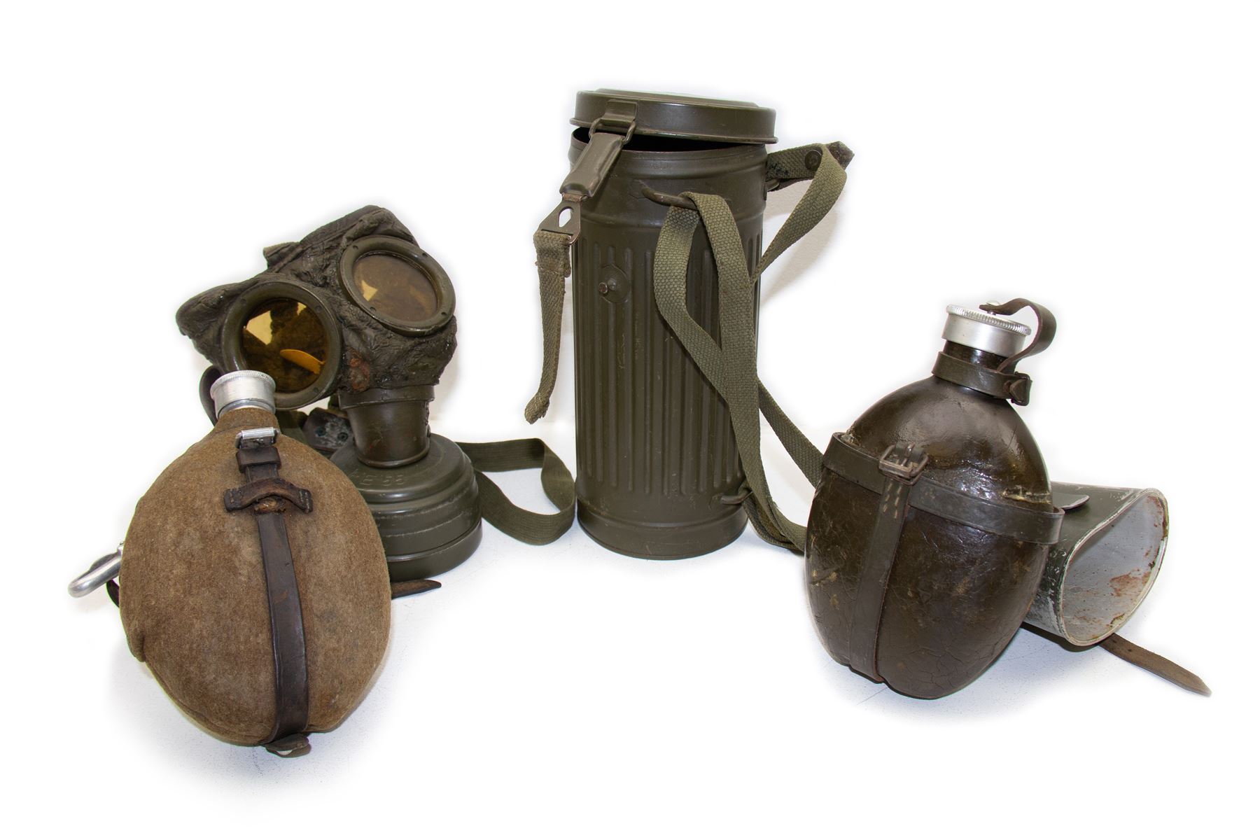 Two WWII German army canteen water bottles, together with German gas mask marked FE55 in a green fluted tin canister