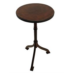 Early 20th century mahogany wine table, figured circular top with reeded edge, on turned and reed moulded stem, three reeded tapered supports on rectangular moulded pad feet 