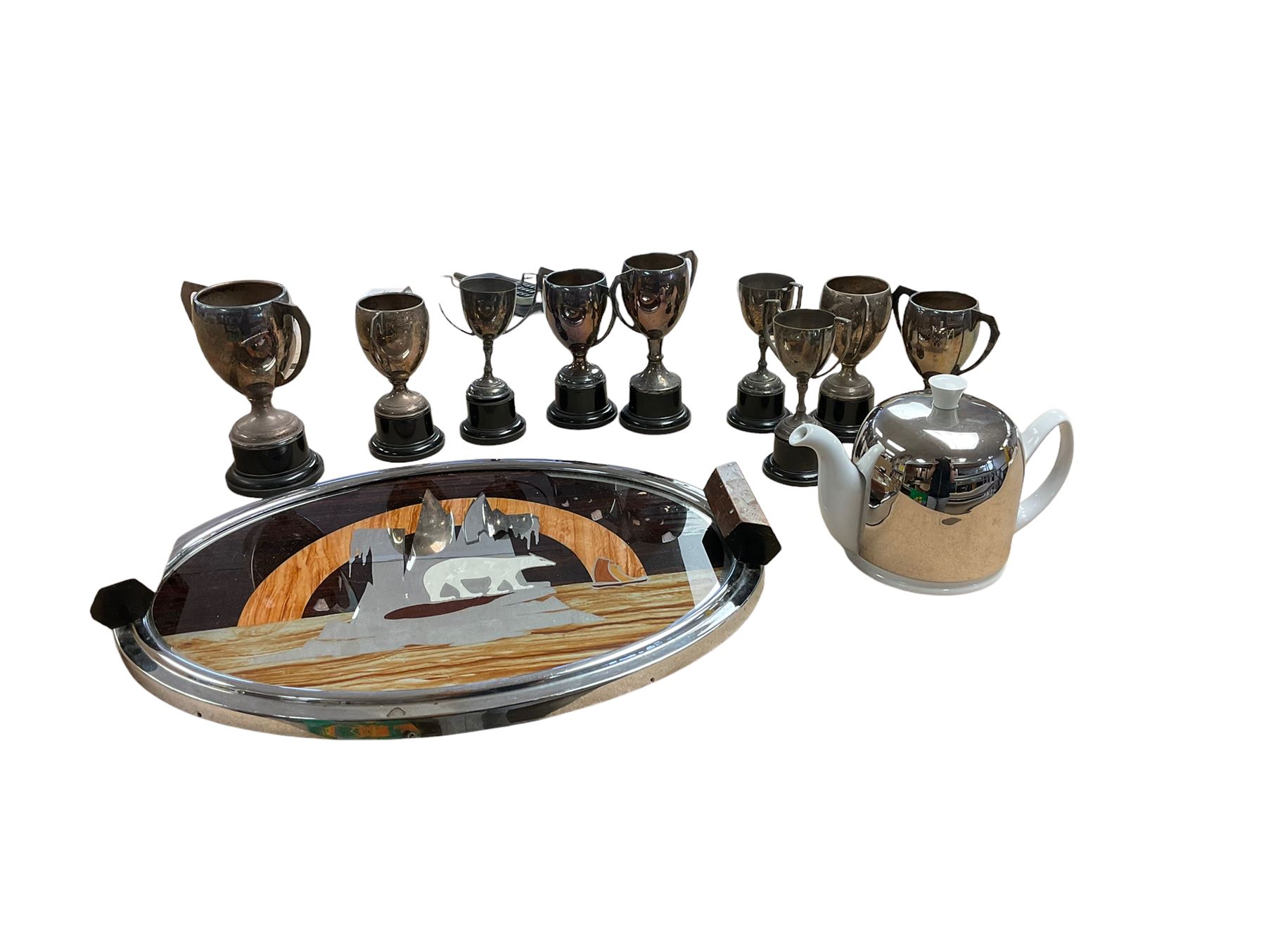 Degrenne Salam White Teapot, together with a collection of silver plated trophy's, etc 