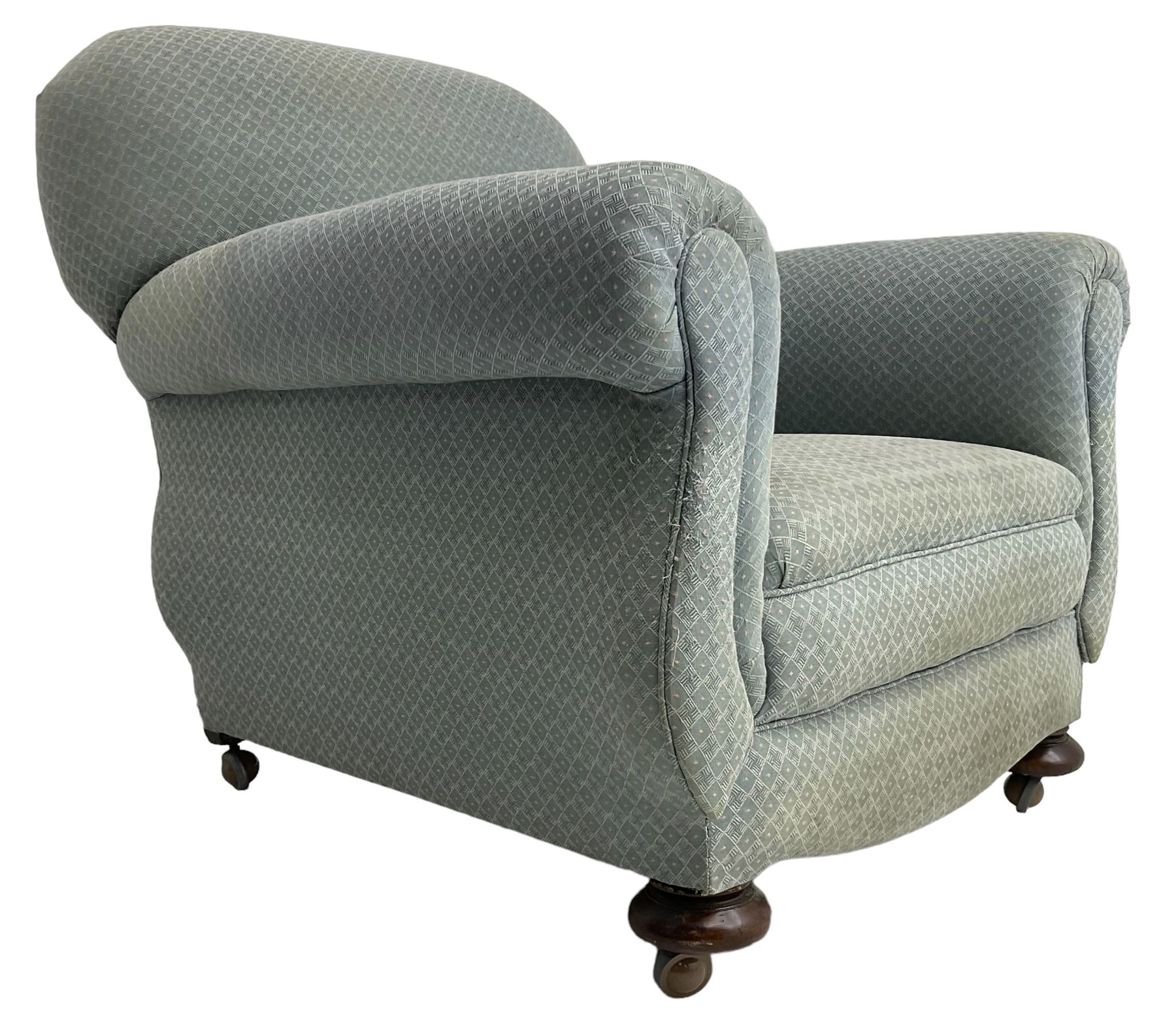 20th century traditional shape armchair, curved back and rolled arms, upholstered in light blue patterned fabric, on turned front feet