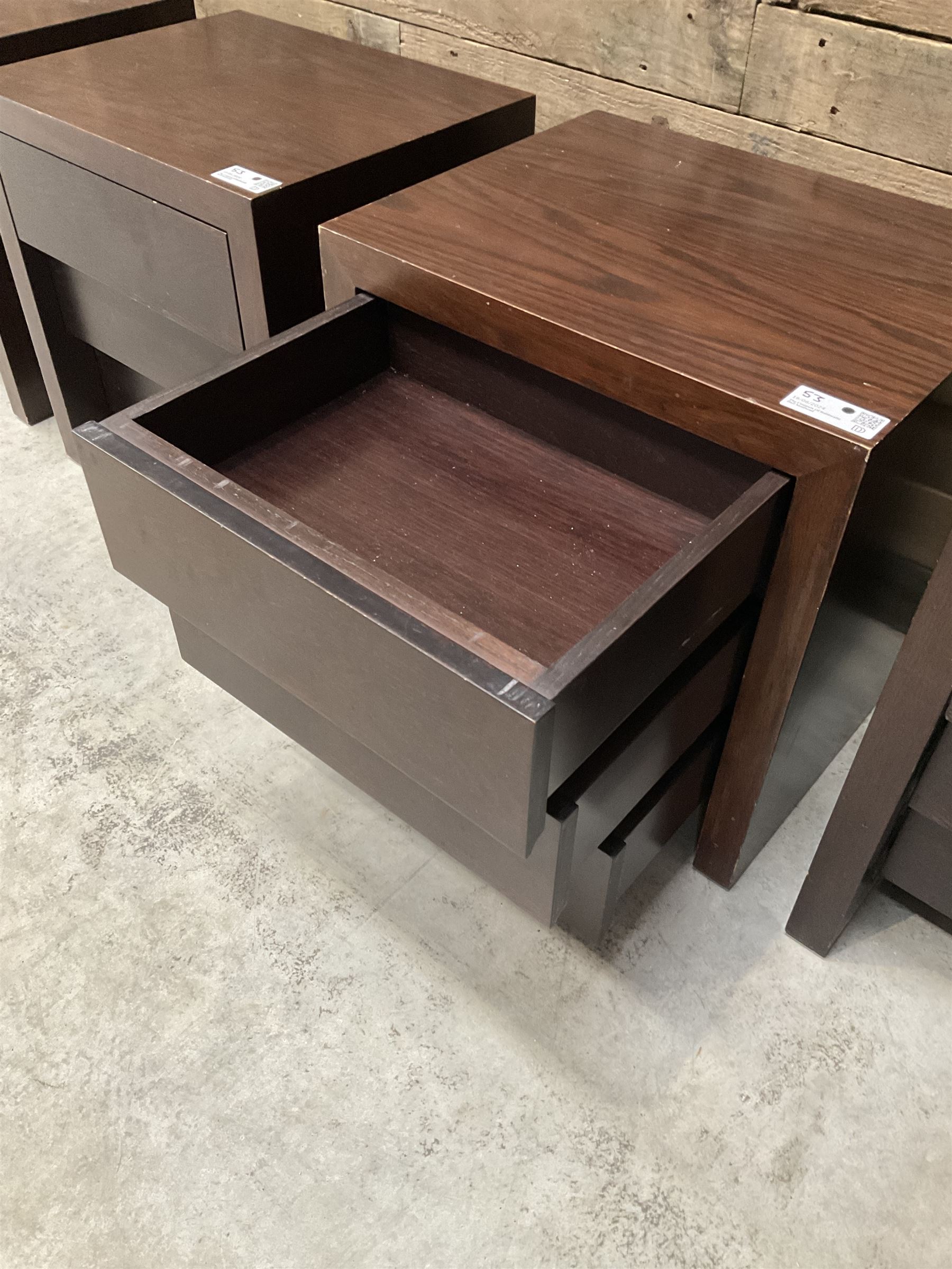 Four rosewood bedside chests, fitted with three stepped soft-close drawers