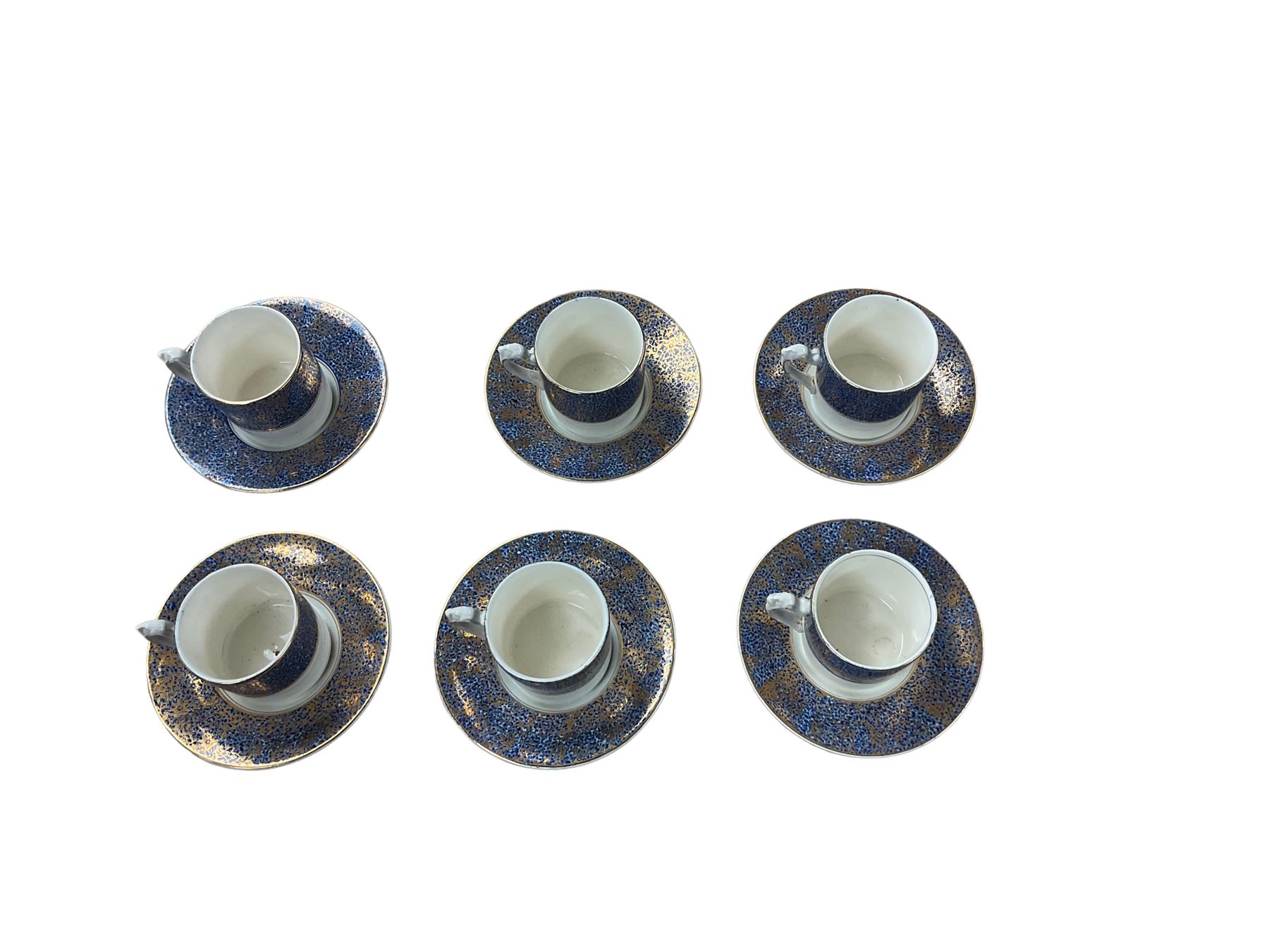 Set of six gilt and cobalt blue coffee cans and saucers