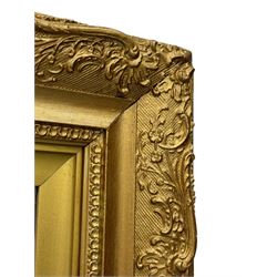 Rectangular wall mirror, in ornate gilt frame decorated with trailing leafy branches and flower heads 