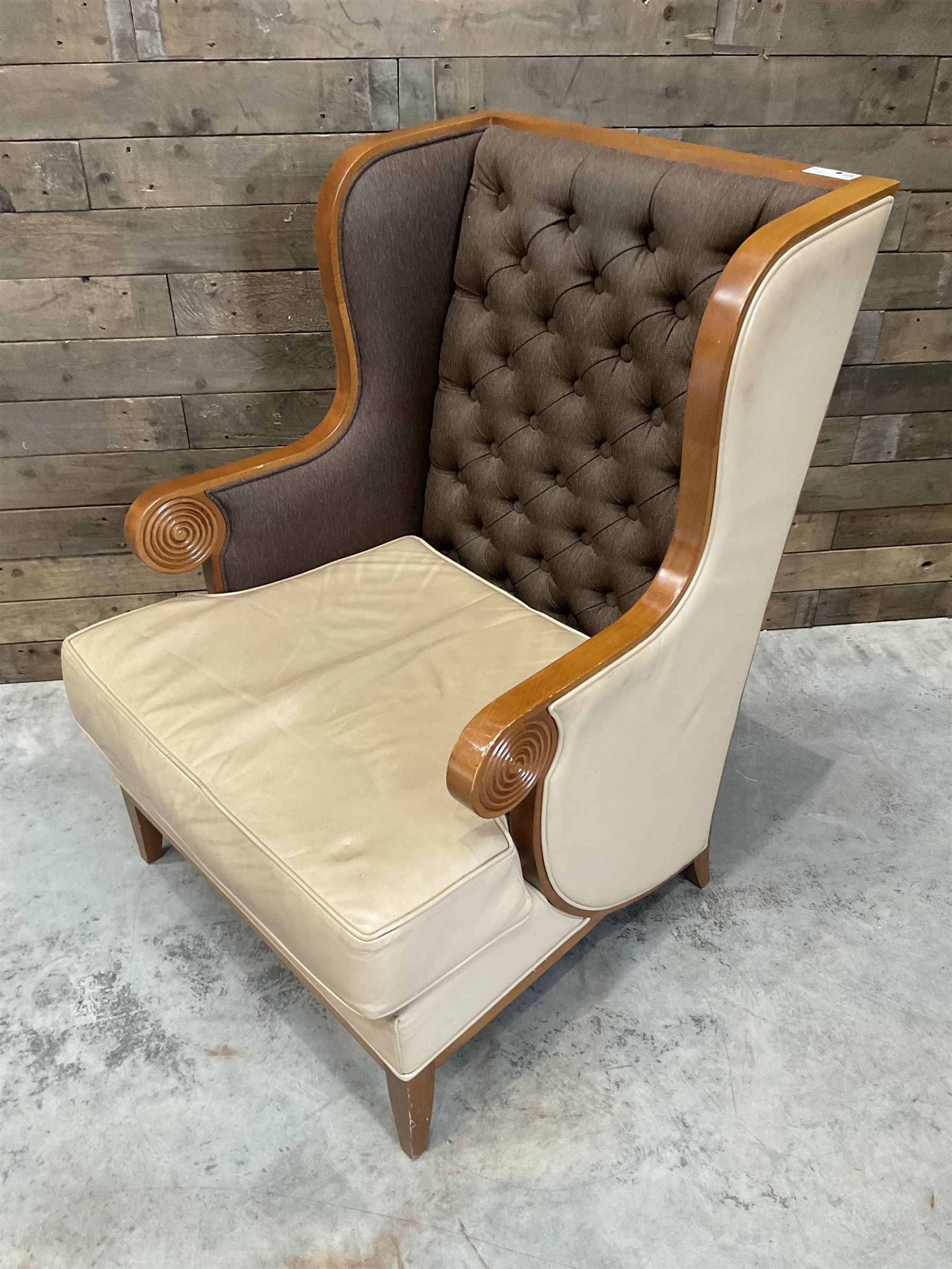 Walnut finish framed wing back armchair upholstered leather and buttoned fabric