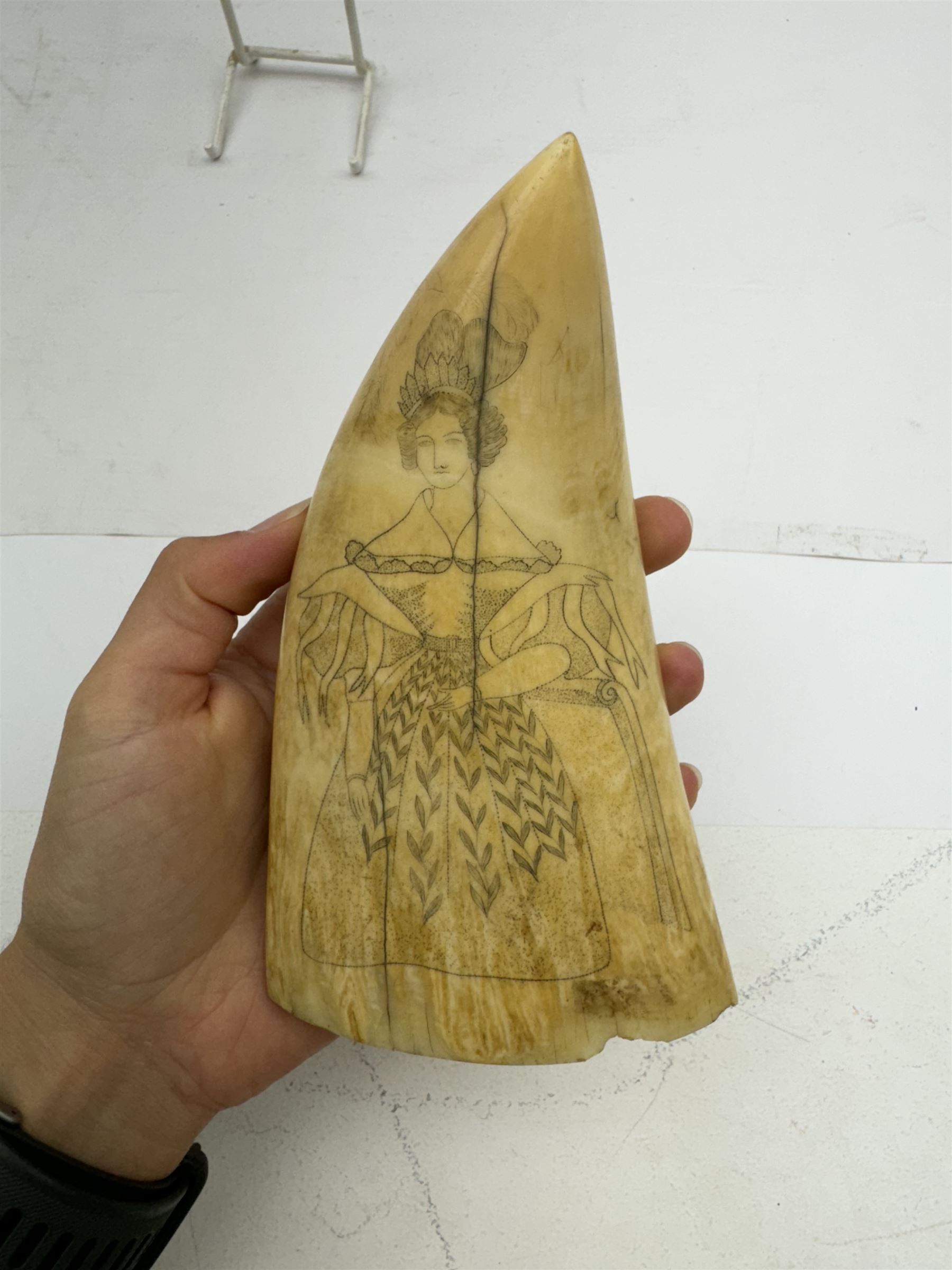 19th century scrimshaw whale tooth, depicting a woman in period dress, L17cm