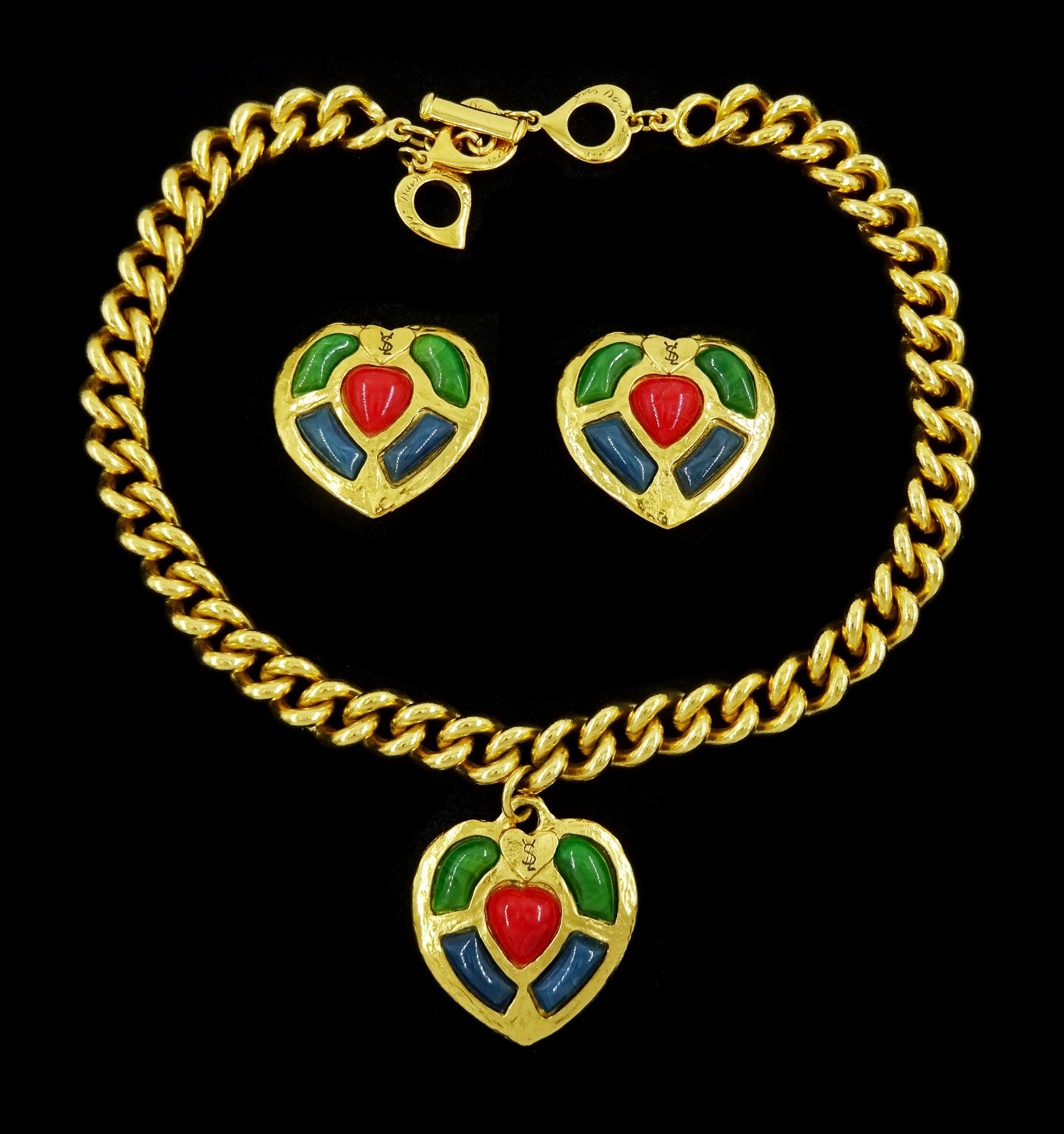 Yves Saint Laurent gilt heart pendant necklace and a pair of matching clip on earrings, circa 1990's