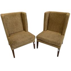 Two wing back armchairs, upholstered in oatmeal fabric