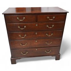 George III oak chest, rectangular protruding top with moulded edge, fitted with two short over four long graduating drawers, with moulded facias and brass swan neck handles, lower moulded edge on bracket feet