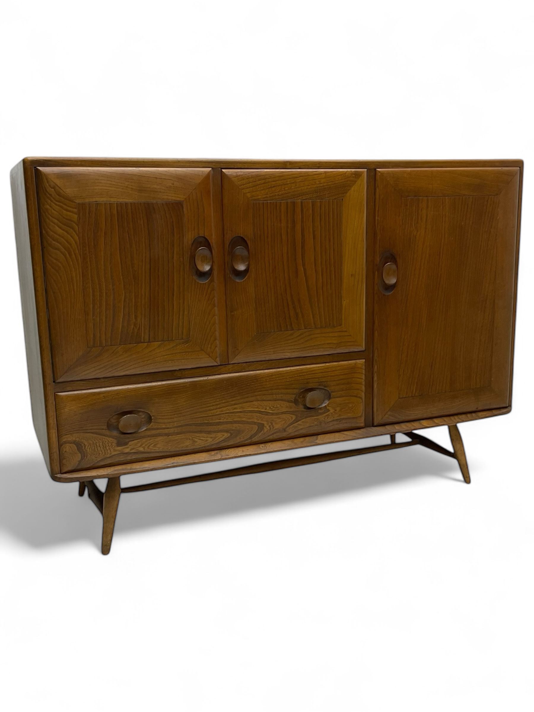 Lucian Ercolani for Ercol - 1960s elm sideboard, fitted with double cupboard, single cupboard and drawer, on tapering supports 