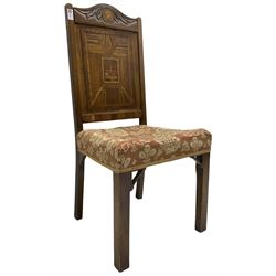 19th century walnut side chair, foliage carved cresting rail over geometric inlaid back with central panel depicting buildings, upholstered seat, on moulded and chamfered square supports