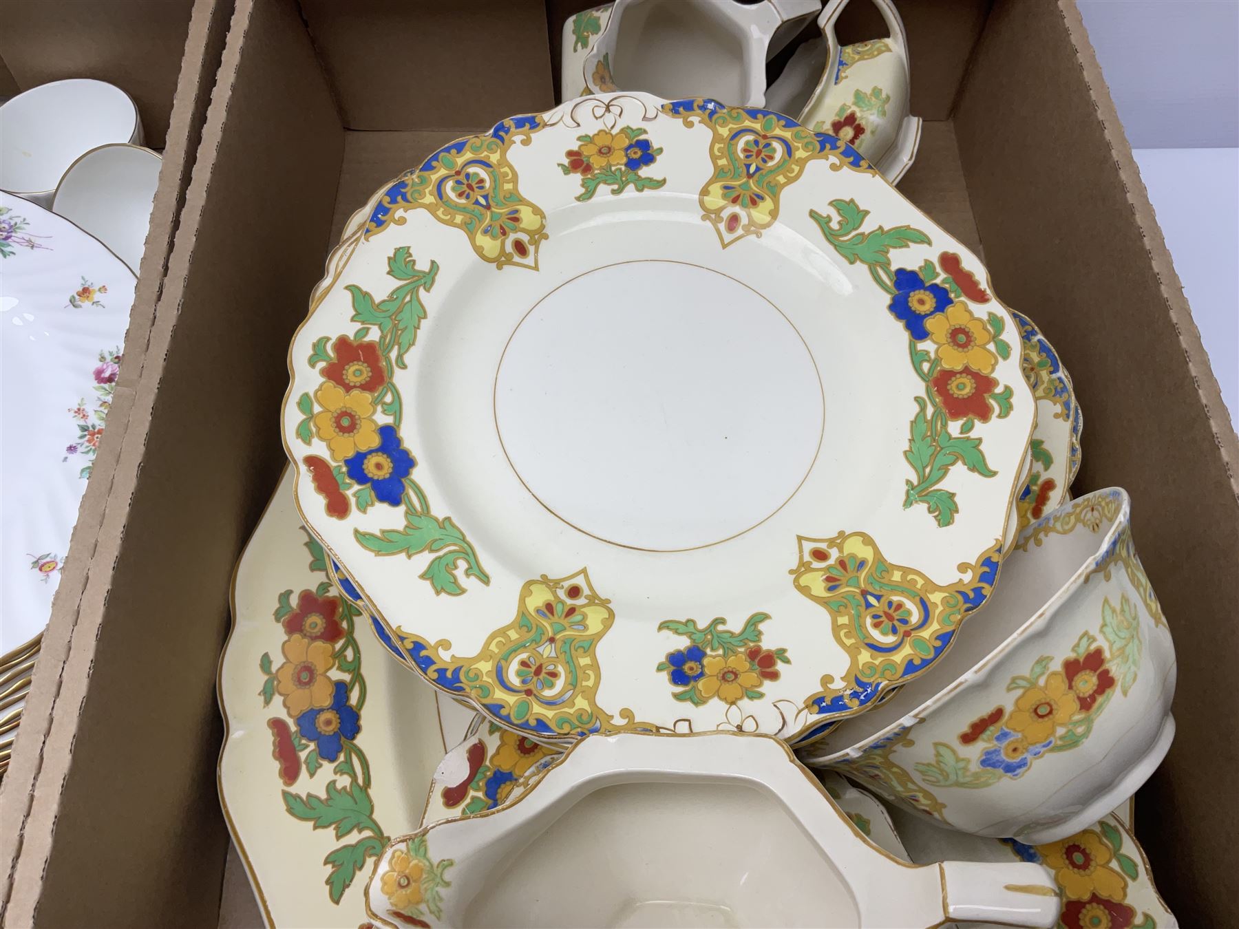 Minton Marlow pattern tea and dinner wares, including dinner plates, side plates, tea cups, cake plate, etc together with Bishops & Stonier 'Bisto' green and gilt tea wares and Maddock Ivory Ware dinner wares, in three boxes