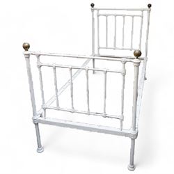 Victorian white painted cast iron 3' single bedstead, brass finials over floral moulded spindles, on castors