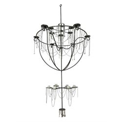 Large bespoke wrought iron cage candle chandelier, the top tier with six extending branches over bell-shape cage with scrolled supports and six branches, six branch lower tier; together with ceiling winch 