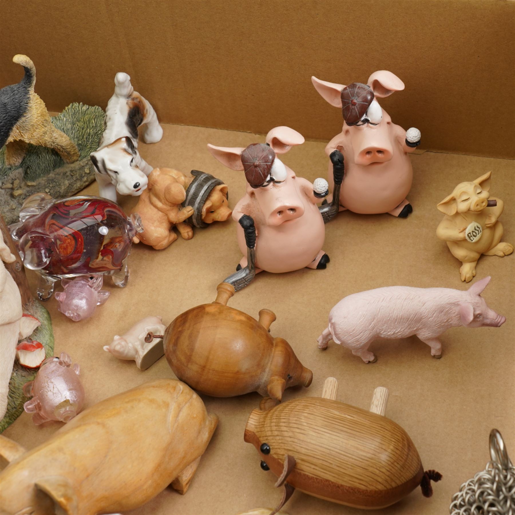 John Beswick family of four pigs, Beswick Airedale Terrier Cast Iron Monarch, together with other animal figures, in one box