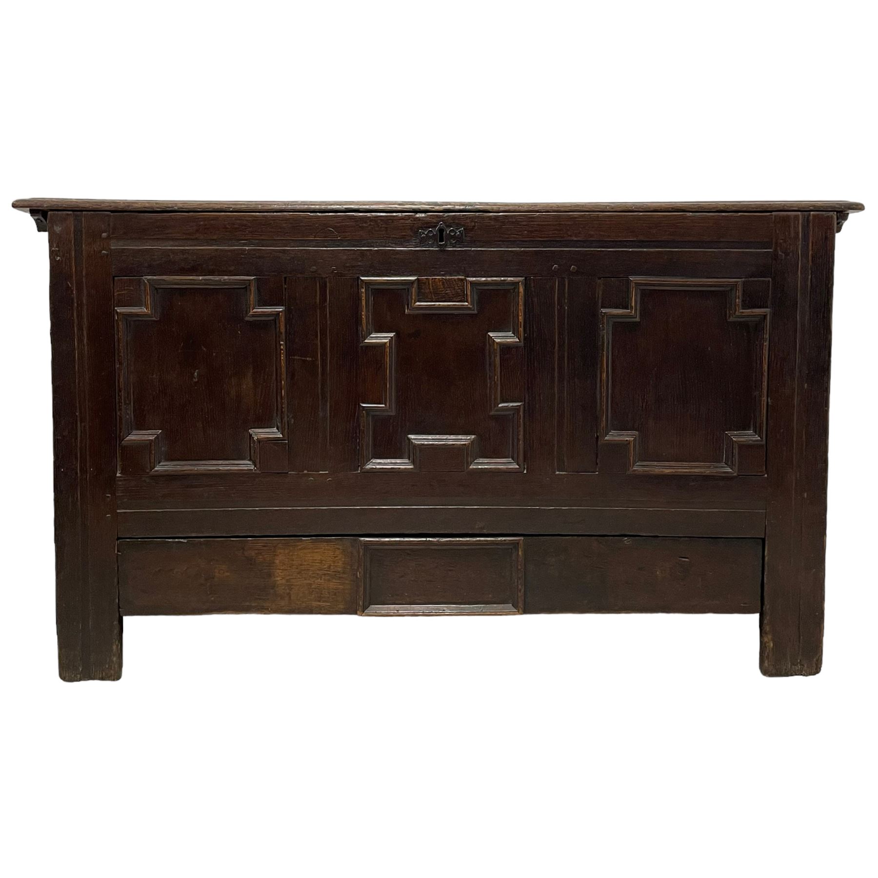 18th century oak mule chest, rectangular hinged top with moulded edge enclosing candle box, the triple panelled front with geometric fielded mouldings, fitted with single drawer to base, raised on stile feet