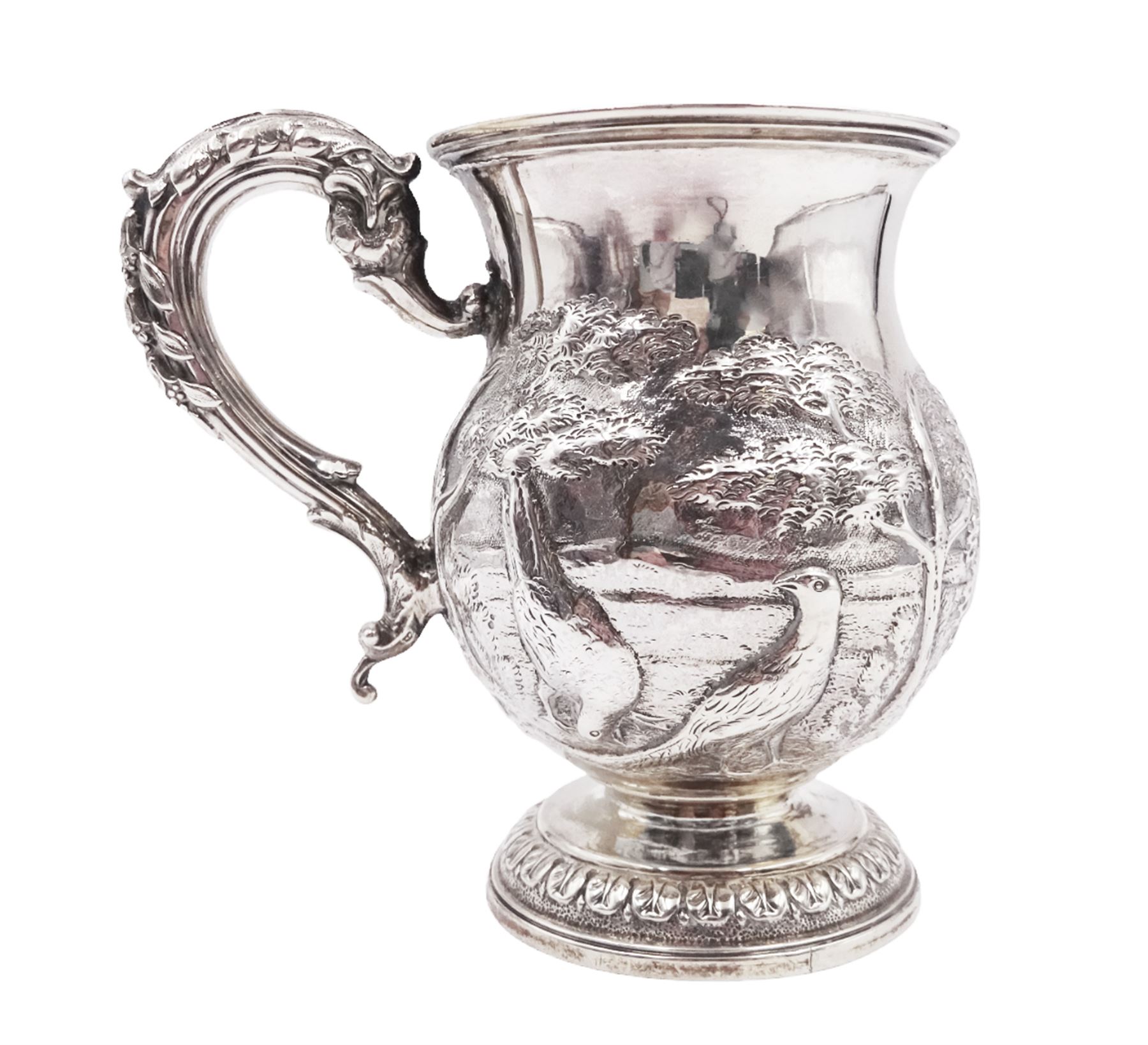 William IV silver christening mug, of waisted form, the body embossed with game birds in a countryside setting and a blank circular cartouche, with acanthus leaf capped scroll handle, upon a circular stepped foot, hallmarked Edward, Edward junior, John & William Barnard, London 1831, H10.2cm