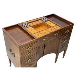 Late 19th century mahogany and satinwood dressing chest, the raised middle section hinges to reveal an interior fitted with lidded compartments, removable tray, single drawer and glass scent bottles, lift-up bevelled mirror with adjustable hinged mechanism, fitted with a further eight cock-beaded graduating drawers and curved kneehole with double cupboard, square tapering supports on brass cups and castors, inlaid throughout with checkered stringing, ornate Rococo cast gilt metal handles