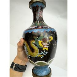 Pair of Japanese cloisonné vases of baluster form, decorated with dragons chasing a flaming pearl, H26cm 