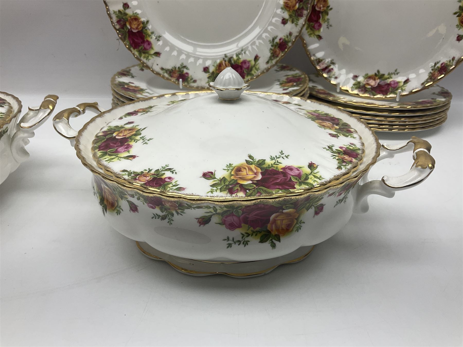 Royal Albert Old Country Roses pattern part tea and dinner service, to include two tureens, eight dinner plates, six side plates, twelve bowls, two mugs, seven teacups and saucers, milk jug,  twelve cake plates, six soup bowls and saucers, candlesticks, etc (95)