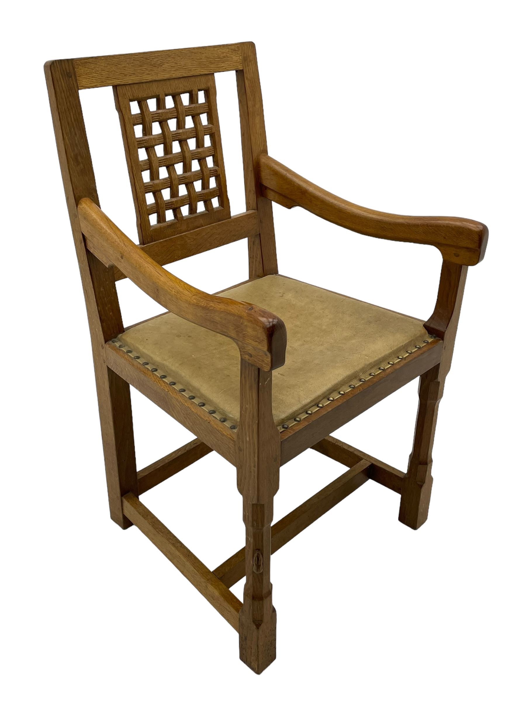 Rabbitman - set of six (5+1) oak dining chairs, pierced and carved lattice back, leather upholstered seat with stud band, on octagonal supports united by stretchers, carved with rabbit signature, by Peter Heap of Wetwang 