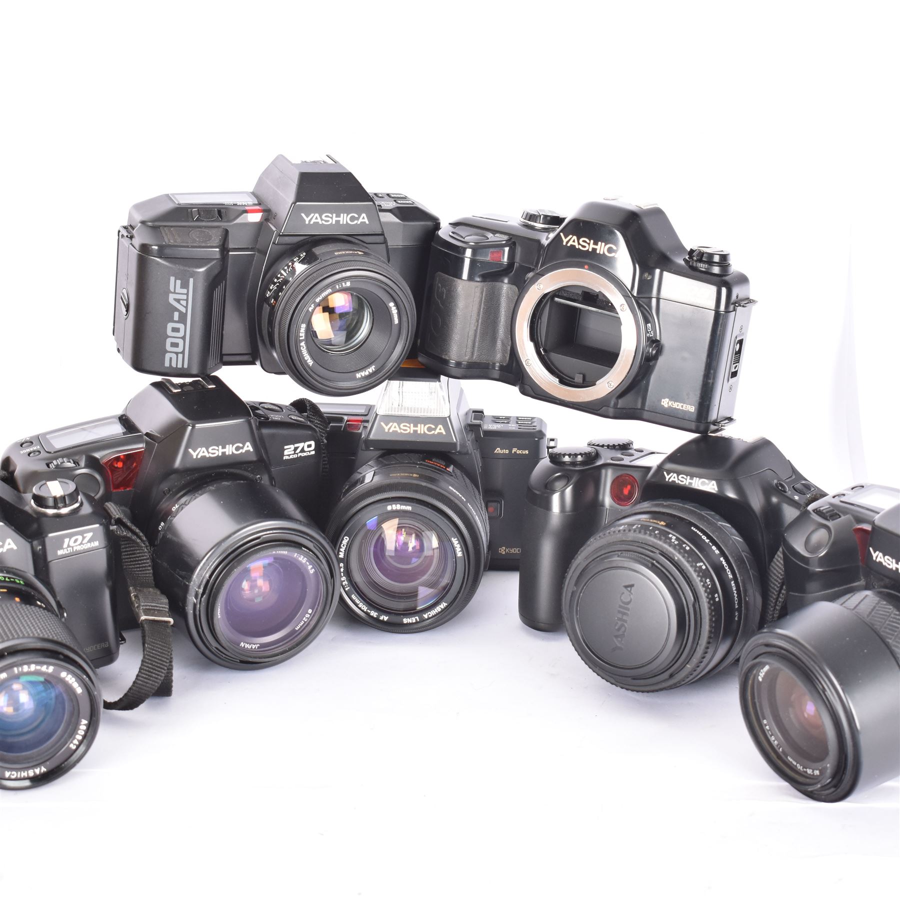 Seven Yashica SLR cameras, comprising two 270 Auto Focus camera bodies serial nos. 016343 & 014624, a 300 Auto Focus serial no. 013055, each with Yashica AF 28-70mm 1:3.5-4.5 lenses, 200 AF camera body serial no. 412426, with an AF 50mm 1:18 lens, 230 AF camera body serial no. 0172124, with an AF 35-105mm 1:3.5-4.5 Macro lens, 107 Multi Program serial no. 5042008, with a MC Zoom 35-70mm 1:3.5-4.5 lens and a 108 Multi Program camera body serial no. 5016848