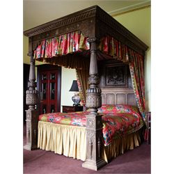 Elizabethan design oak 5' Kingsize four-poster bed, the canopy with projecting moulded and...