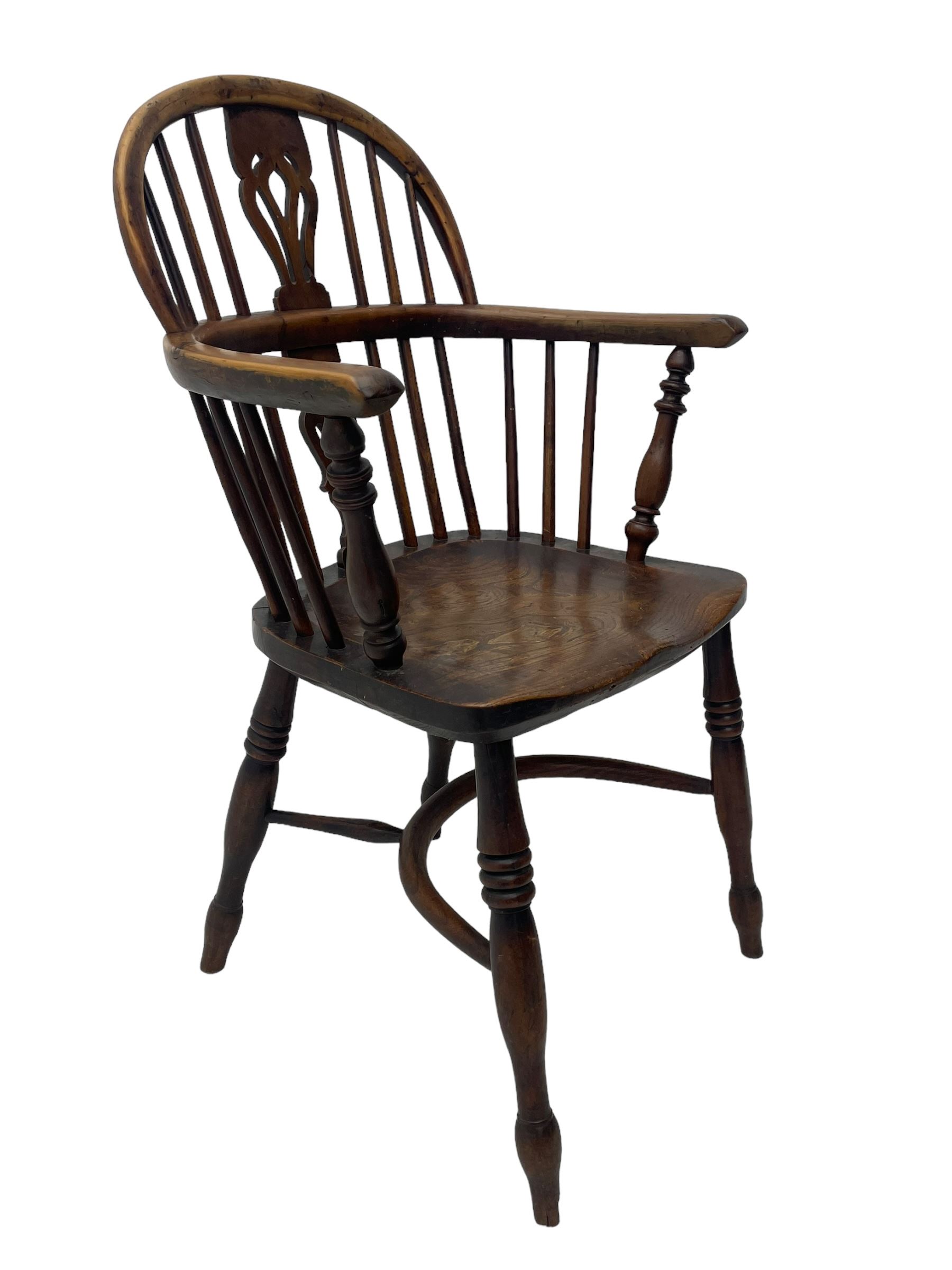 19th century yew wood and elm Windsor armchair, low double hoop stick and pierced splat back, dished seat on turned supports united by crinoline stretchers