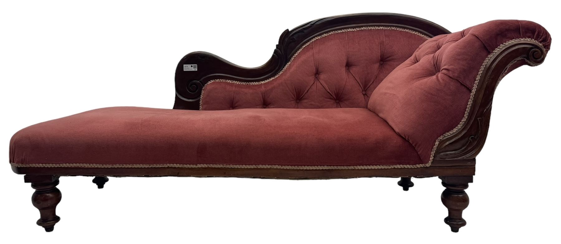 Victorian mahogany framed chaise longue, upholstered in pink velvet, the scrolled back with button-tufting, on turned feet