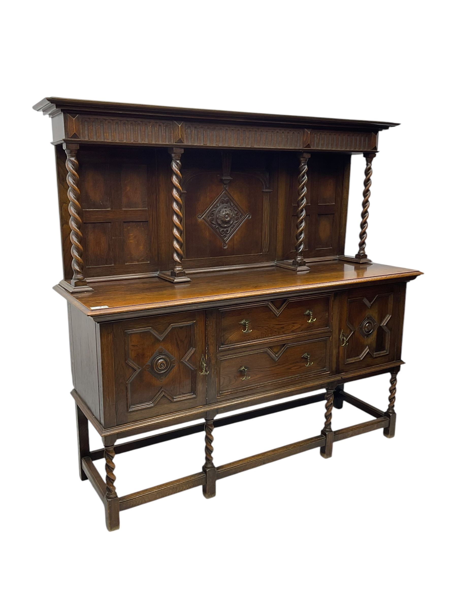 Jacobean Revival oak dresser, projecting moulded cornice over arcade carved frieze and panelled back, on spiral turned supports, moulded rectangular top over two cupboards and two drawers, on spiral turned supports united by moulded stretchers 