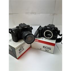 Canon EOS 30V SLR camera body serial no. (21)95000615, with a Canon EF 28-90mm 1:4-5.6 USM zoom lens serial, together with a Canon EOS 30 SLR camera body serial no. (21)71001811, both with original boxes and a Lowepro carry case