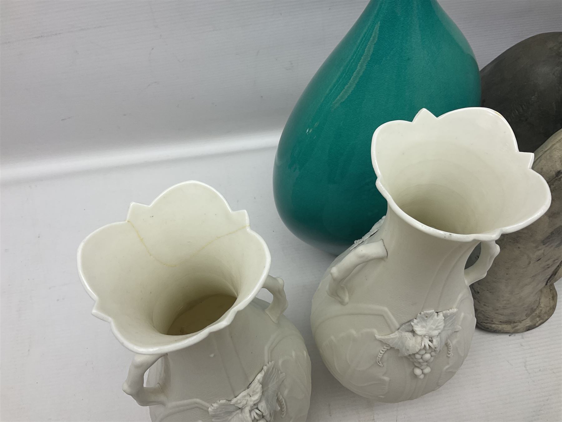 Studio pottery, to include set of four goblets, squat vase and large vase decorated with birds amongst leaves, together with pair of twin handled vases with grape decoration, cat figure, etc, large vase H28cm