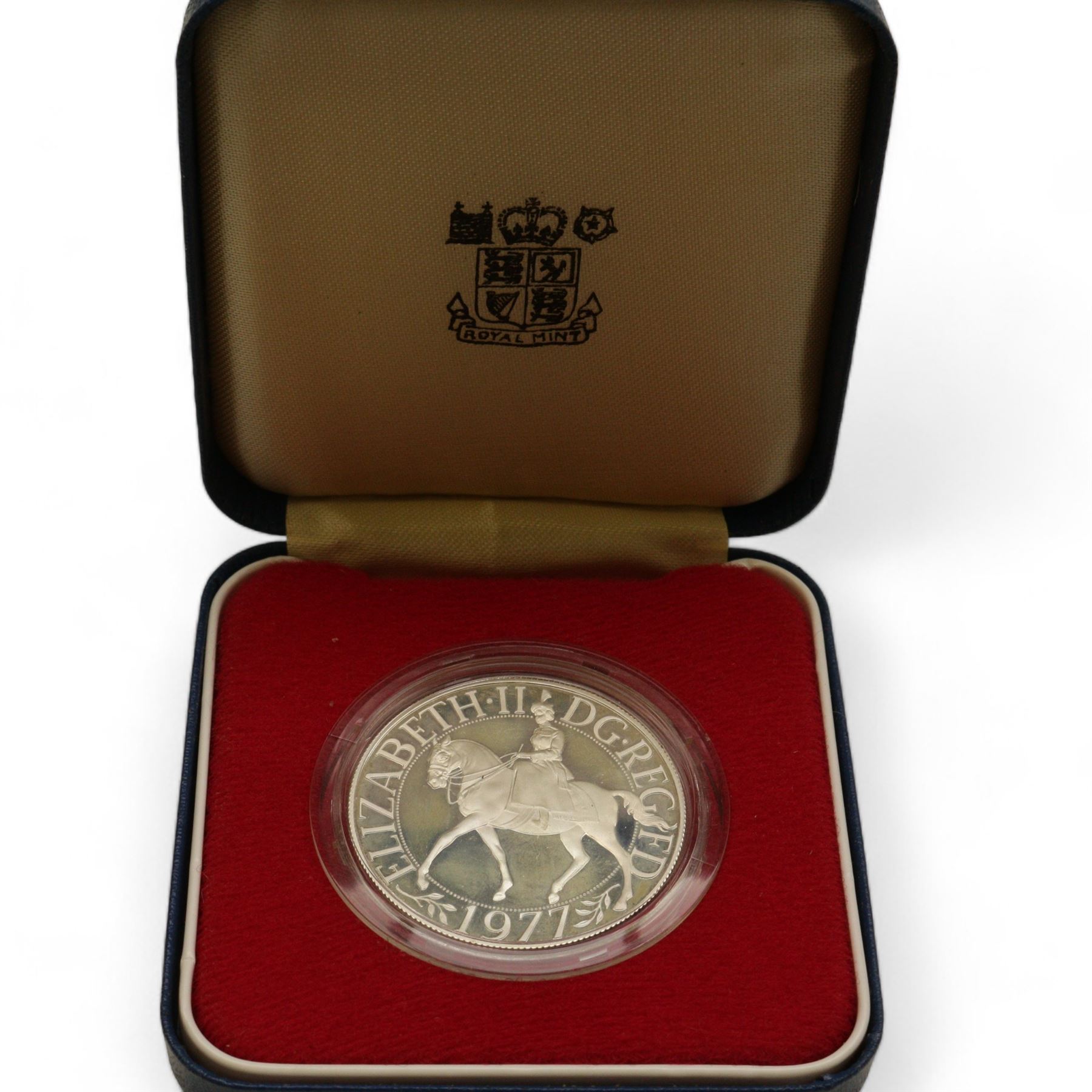 Eight The Royal Mint United Kingdom silver proof coins, comprising 1980 '80th Birthday' crown, 1981 'His Royal Highness The Prince Of Wales And Lady Diana Spencer' crown, 1984, 1985, 1986 and 1987 one pounds, all cased with certificates and a 1977 crown cased no certificate (8)