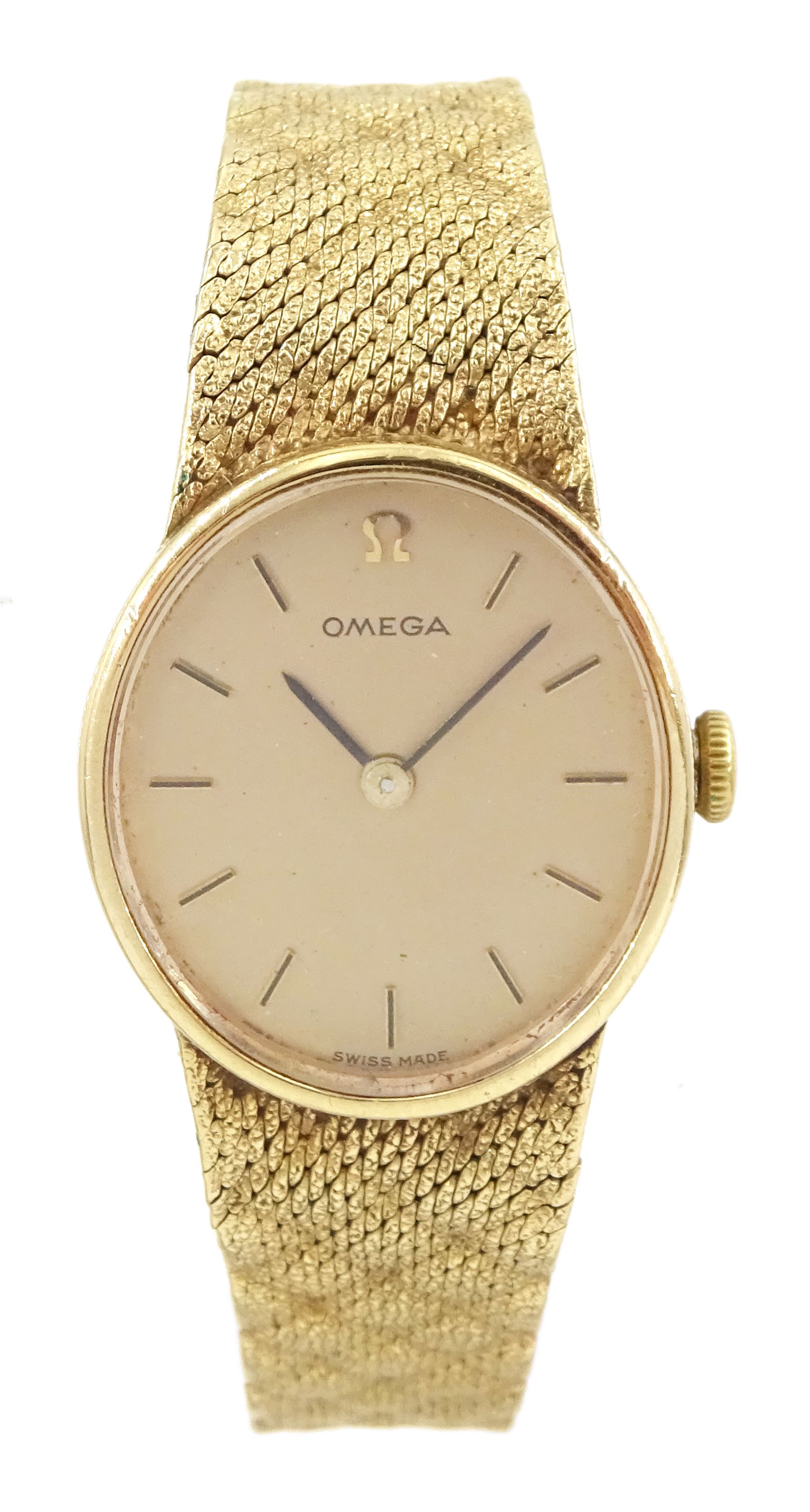 Omega ladies 9ct gold manual wind wristwatch, oval champagne dial with baton hour markers, Cal. 625, on integral 9ct gold bracelet, London 1977/78, boxed with papers