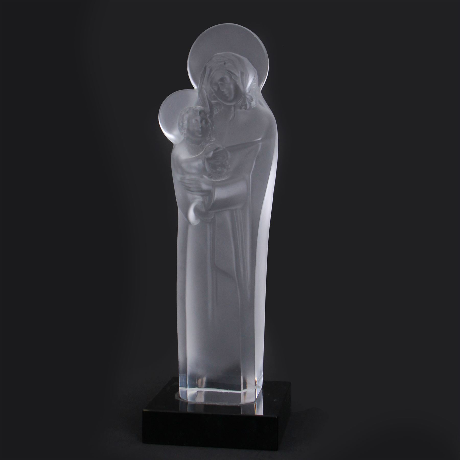 Rene Lalique (French 1860-1945), large crystal figure of the Madonna and Child, model 905, circa 1950, engraved Lalique France, upon square polished black slate plinth, overall H36cm