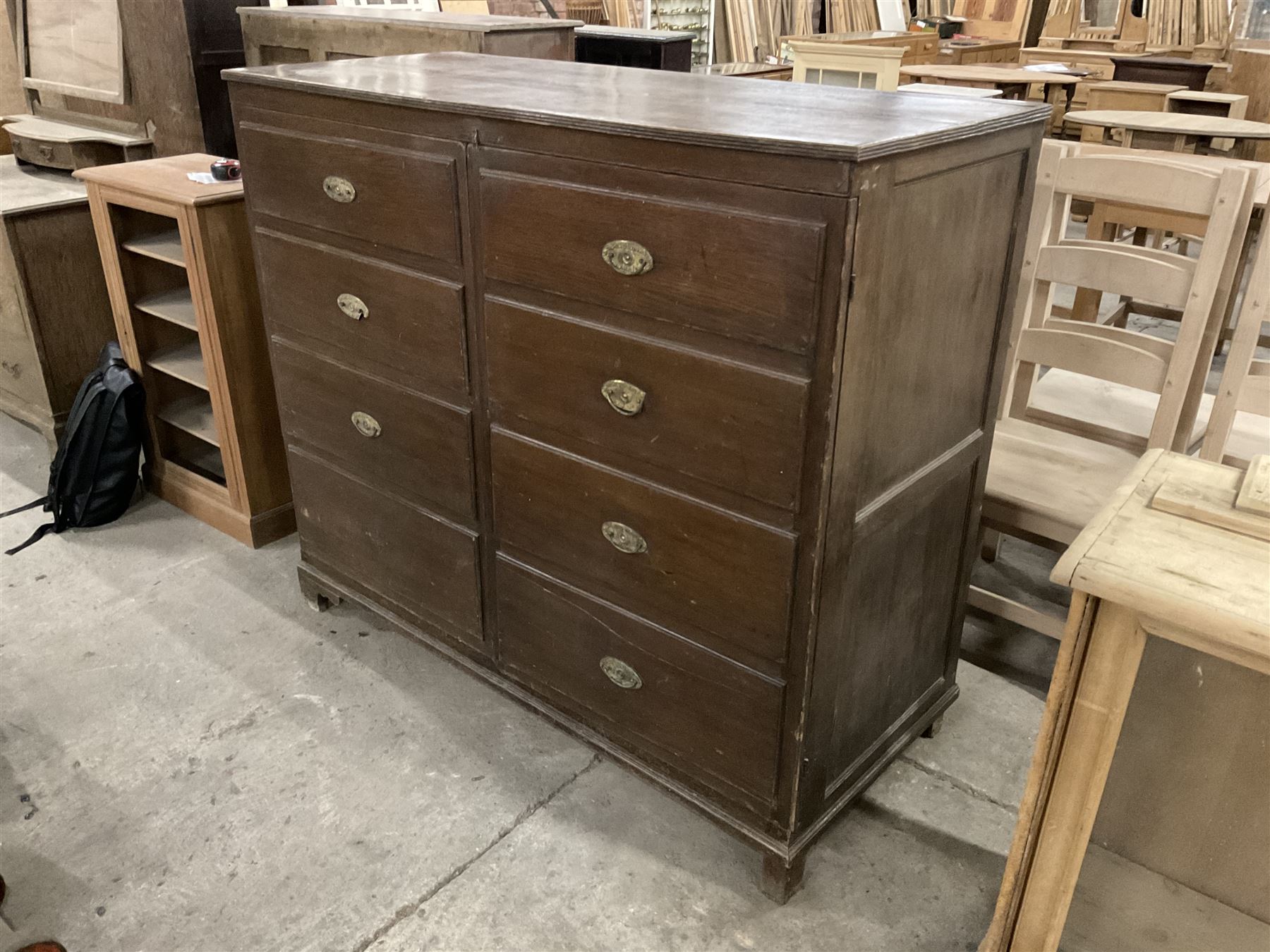 Early 20th century oak cupboard disguised as a chest of eight drawers, reeded edge over two doors with panelled facias - THIS LOT IS TO BE COLLECTED BY APPOINTMENT FROM THE OLD BUFFER DEPOT, MELBOURNE PLACE, SOWERBY, THIRSK, YO7 1QY