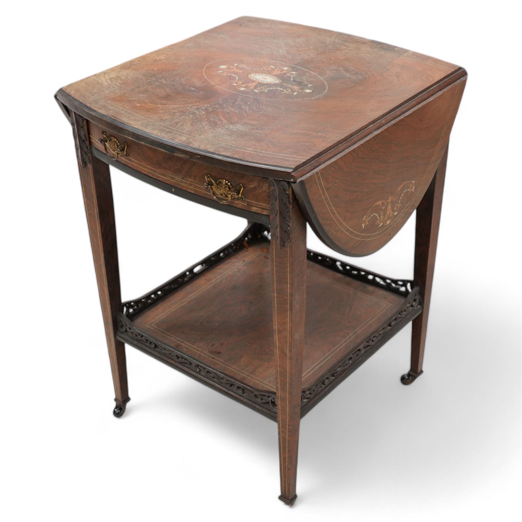 Edwardian inlaid rosewood occasional centre table, oval drop-leaf top inlaid with central fan and extending foliate motifs, fitted with single drawer, on square tapering supports united by galleried undertier, on brass castors 