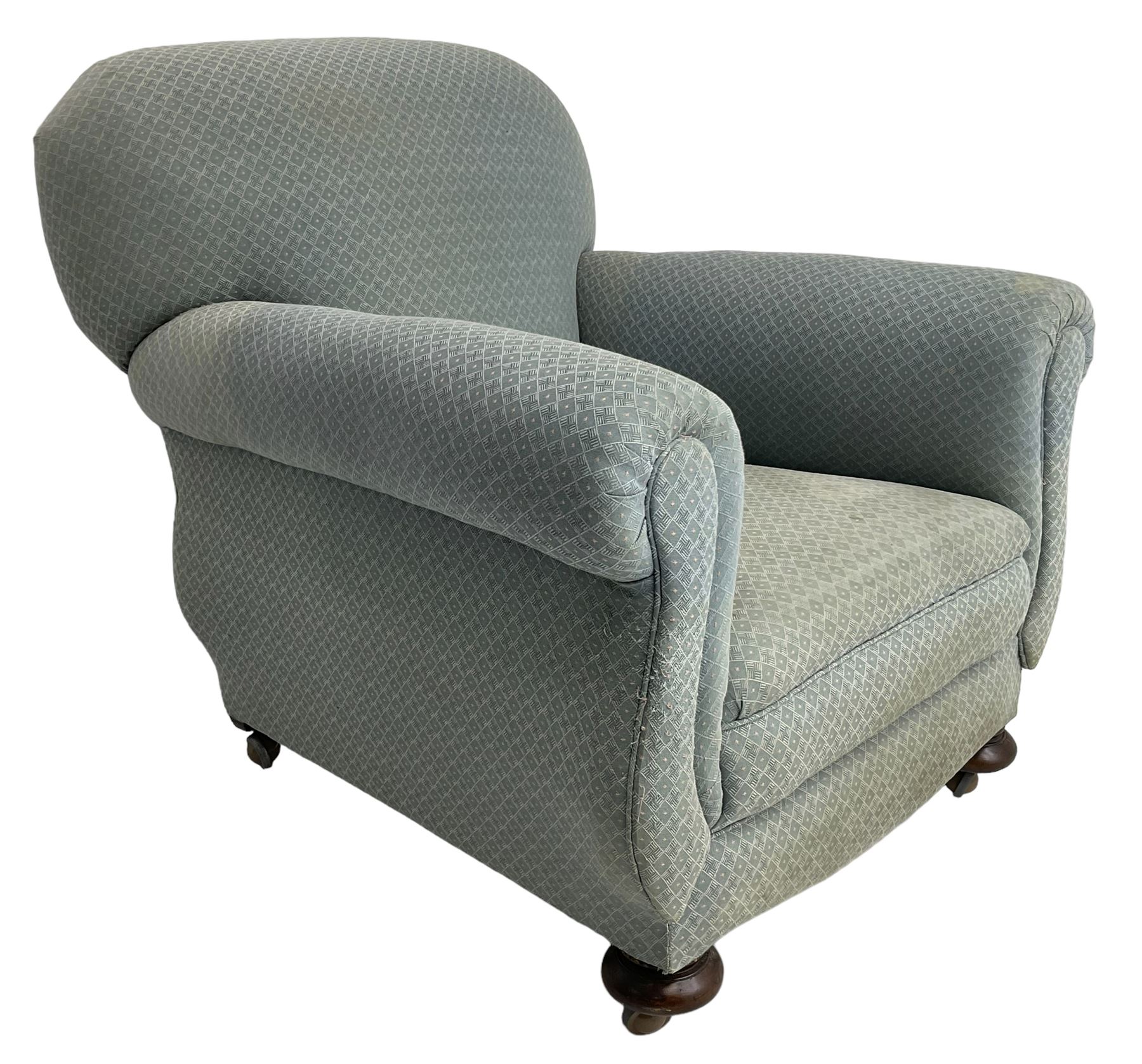 20th century traditional shape armchair, curved back and rolled arms, upholstered in light blue patterned fabric, on turned front feet