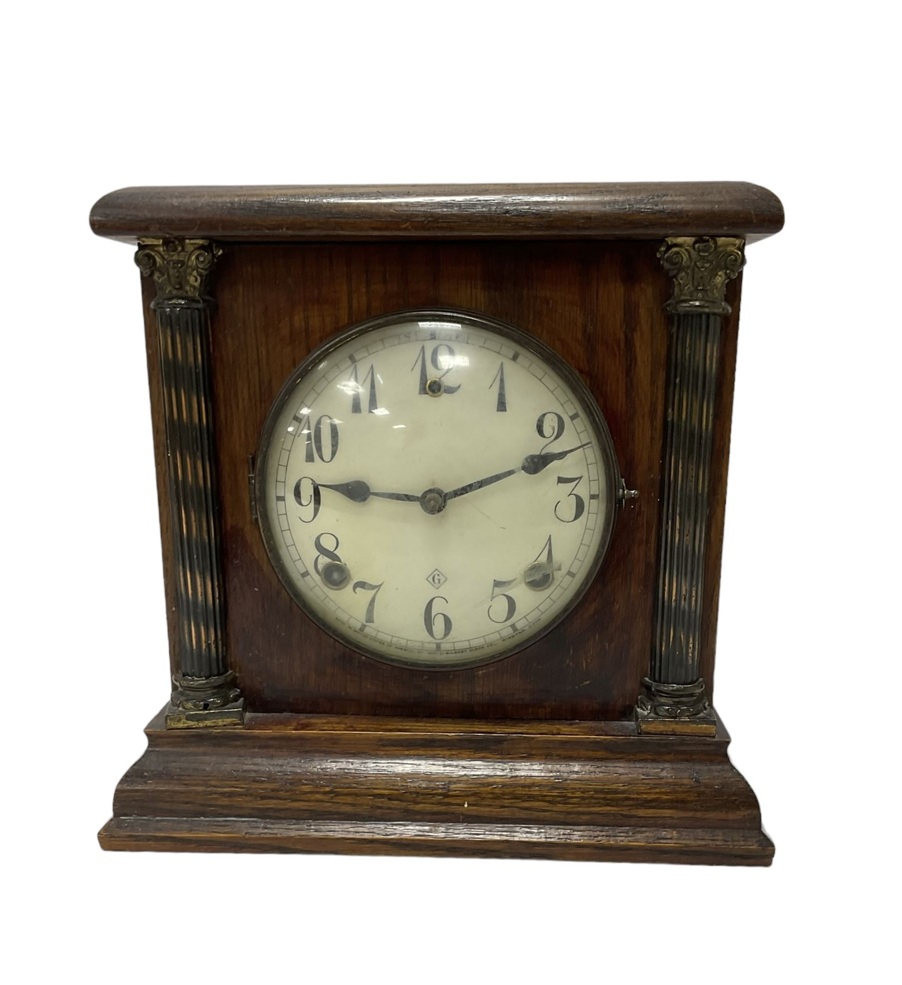 Assortment of three mantle clocks and an aneroid barometer.