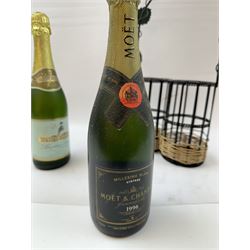 Moet & Chandon 1996 champagne, together with Babycham sparkling perry, in a wine holder, various contents and proof 