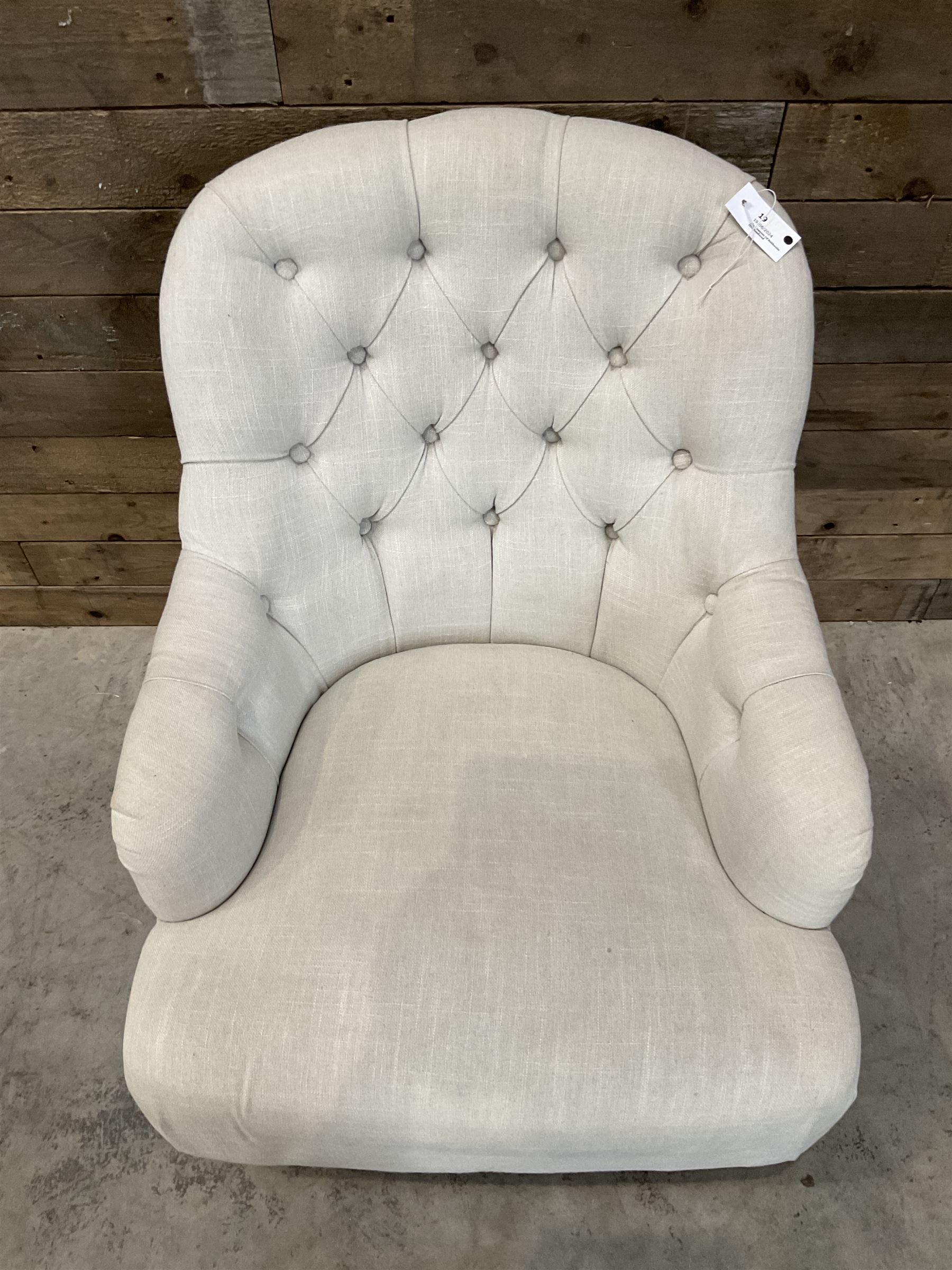 Armchair upholstered in button back linen fabric