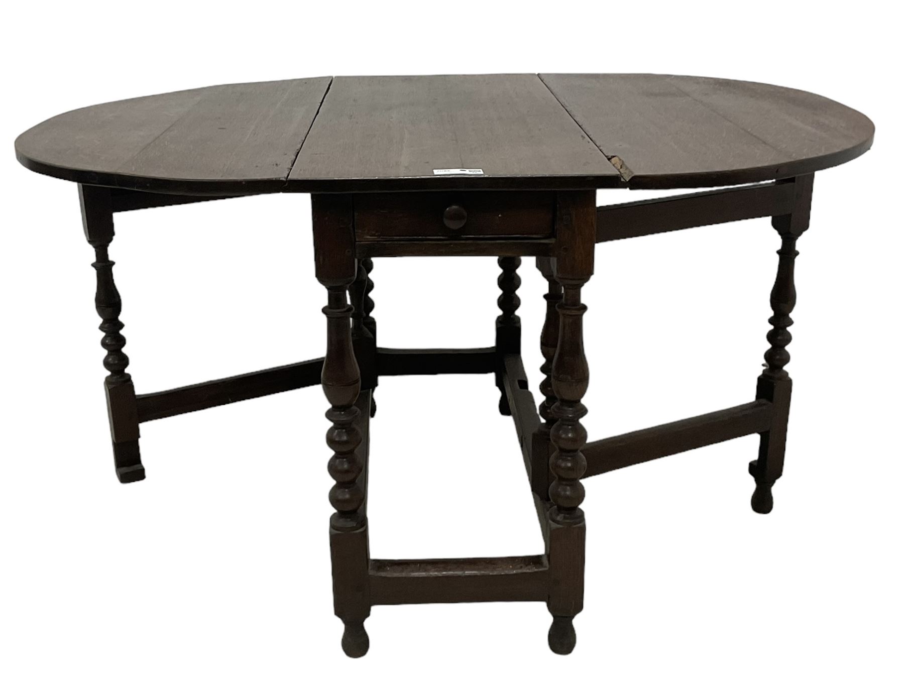 18th century country oak drop-leaf table, oval top, fitted with single drawer, raised on double gate-leg action bobbin-turned supports, united by stretchers