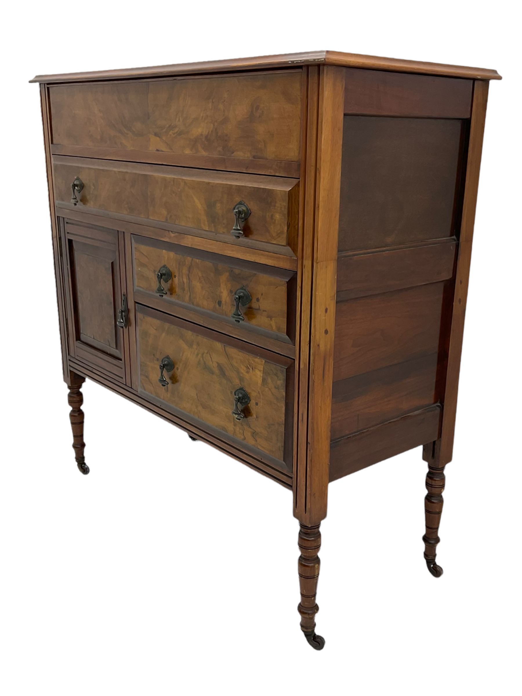 Edwardian walnut gentleman's tallboy, moulded hinged lid enclosing divisions, long drawer over two short drawers and panelled cupboard, turned supports terminating at ceramic castors