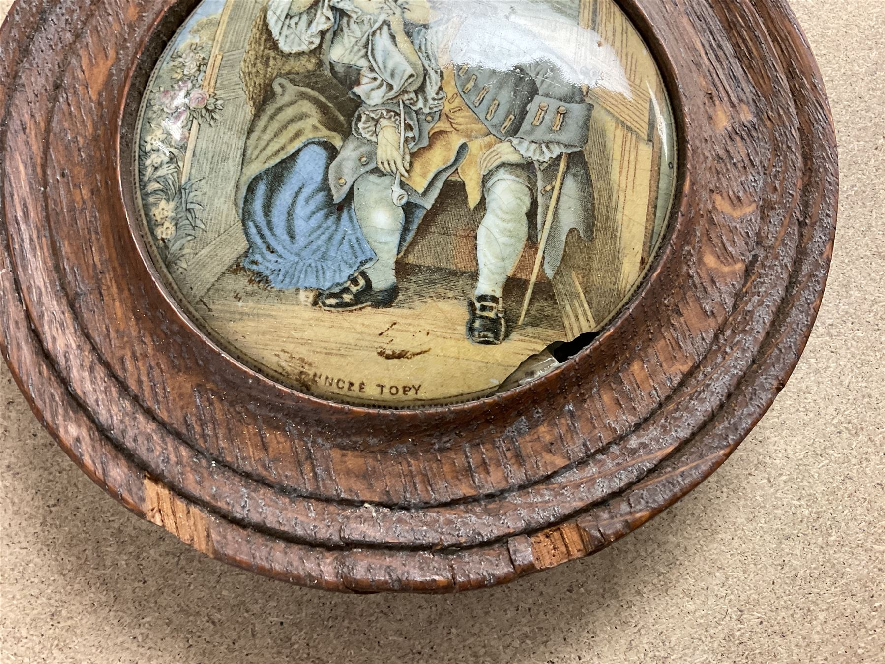 Two framed Victorian Pratt ware pot lids, the first example depicting Queen Victorian titled 'England's Pride', the second titled 'Uncle Topy'