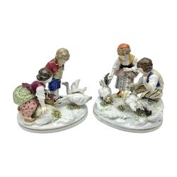 Two 19th century german figures, each modelled as children feeding birds, H19cm 