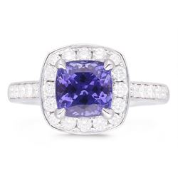 18ct white gold cushion cut tanzanite and round brilliant cut diamond cluster ring, with diamond set shoulders, hallmarked, tanzanite 2.25 carat, total diamond weight approx 0.55 carat