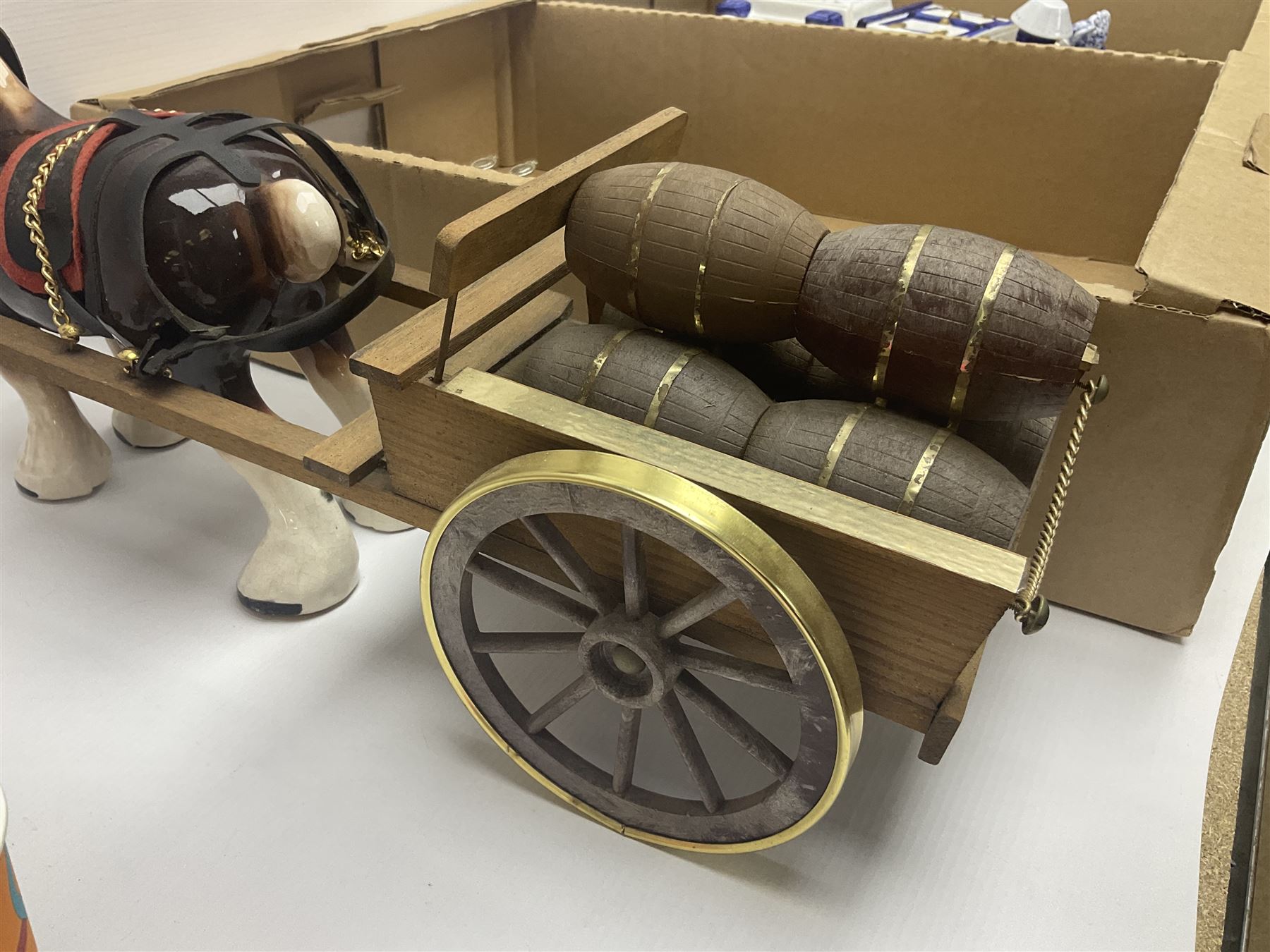 Commemorative ware, including mugs, shots glasses, plates and book etc, together with a ceramic shire horse and wooden cart, four Leonardo blue and white tea pots, and a collection of other ceramics and glassware, in three boxes 