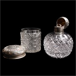 Silver navette shape bread basket with pierced sides, L28cm Chester 1900 Maker William Aitken, globe scent bottle with silver cover, glass dressing table jar with silver lid and a silver backed hairbrush 