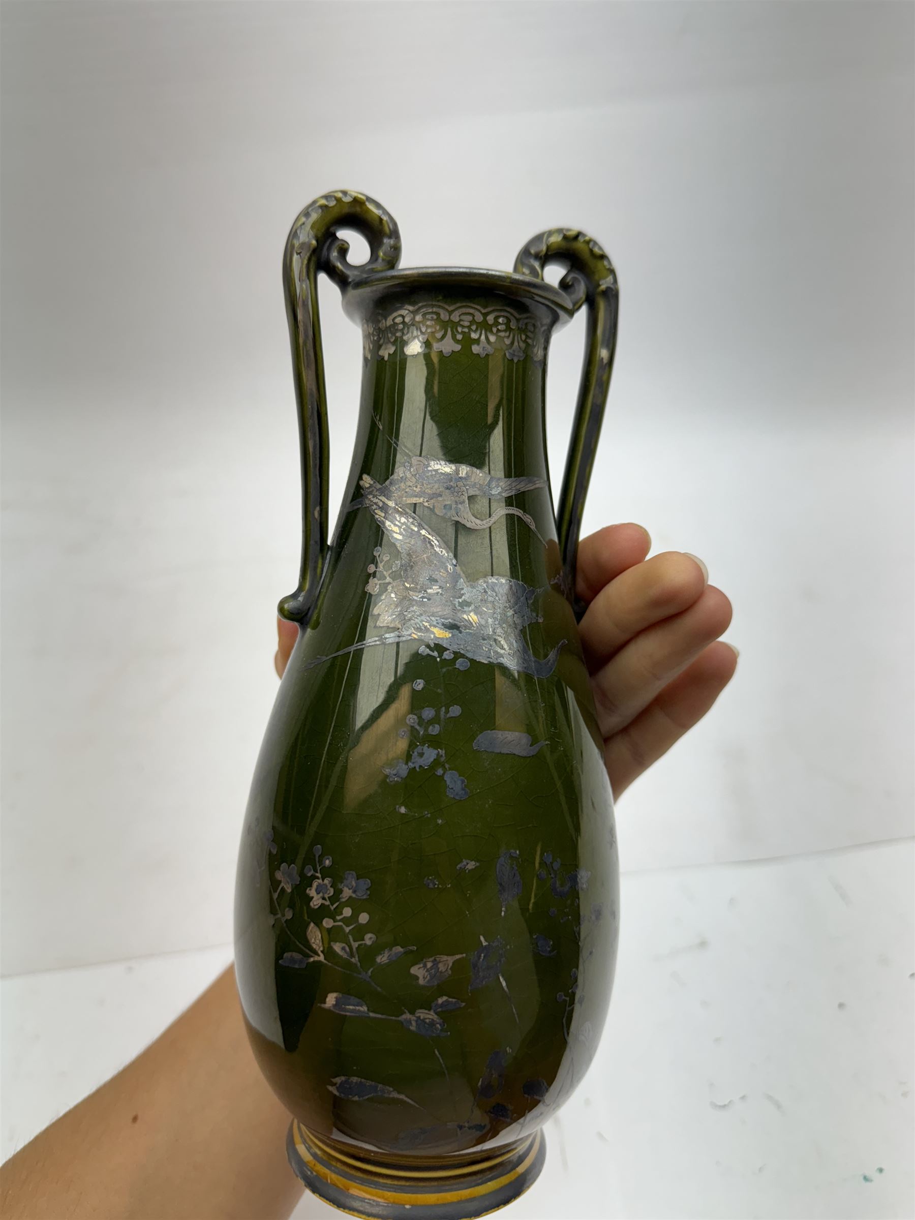 Japanese green twin handled vase, with silver overlay depicting cranes and floral sprigs, H24cm 