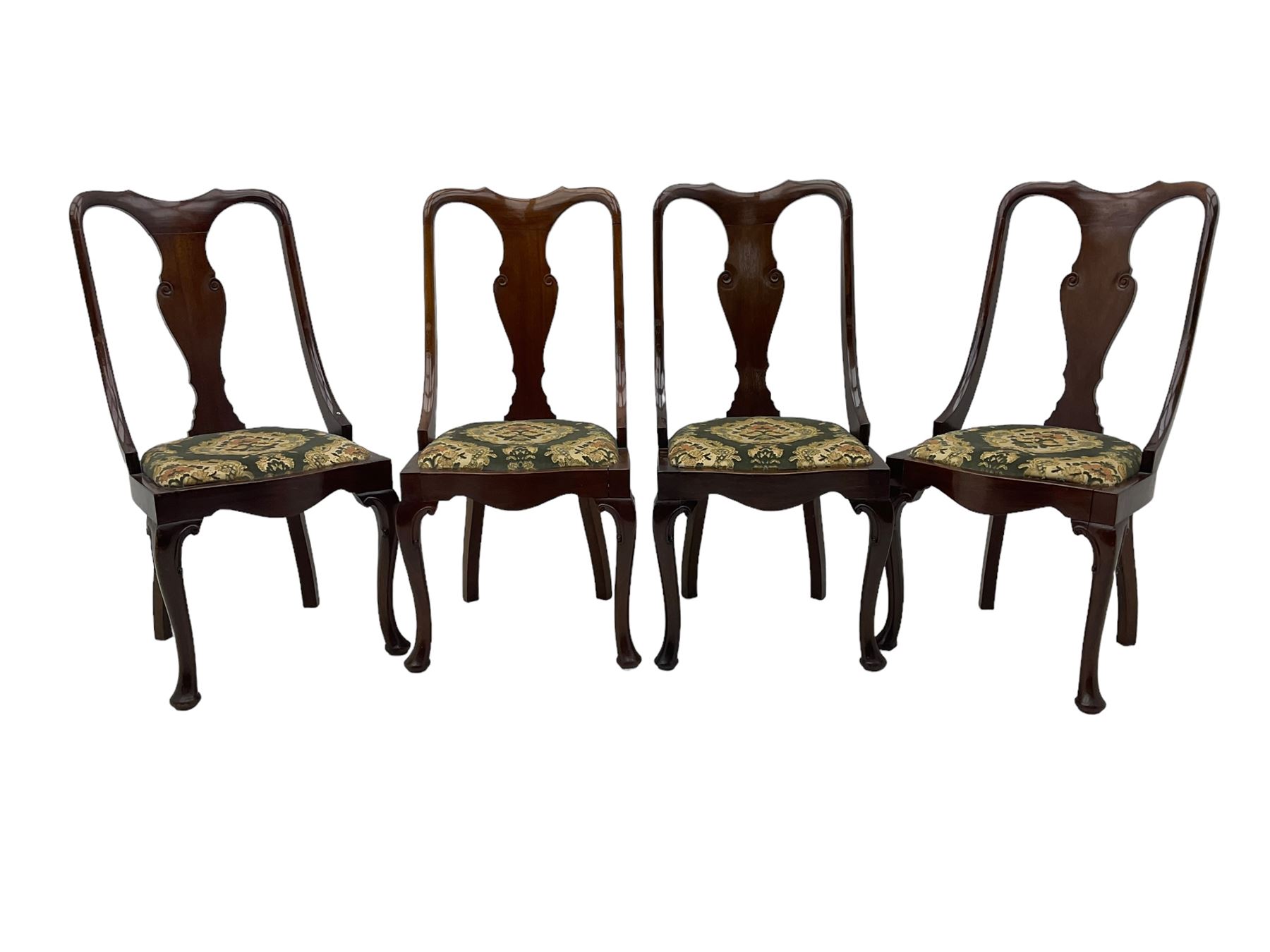 Set of eight late 19th century mahogany spoon back dining chairs, each with shaped top rail over Queen Anne design vase-shaped splat, upholstered seats in floral patterned fabric, raised on cabriole supports with scroll carved knees