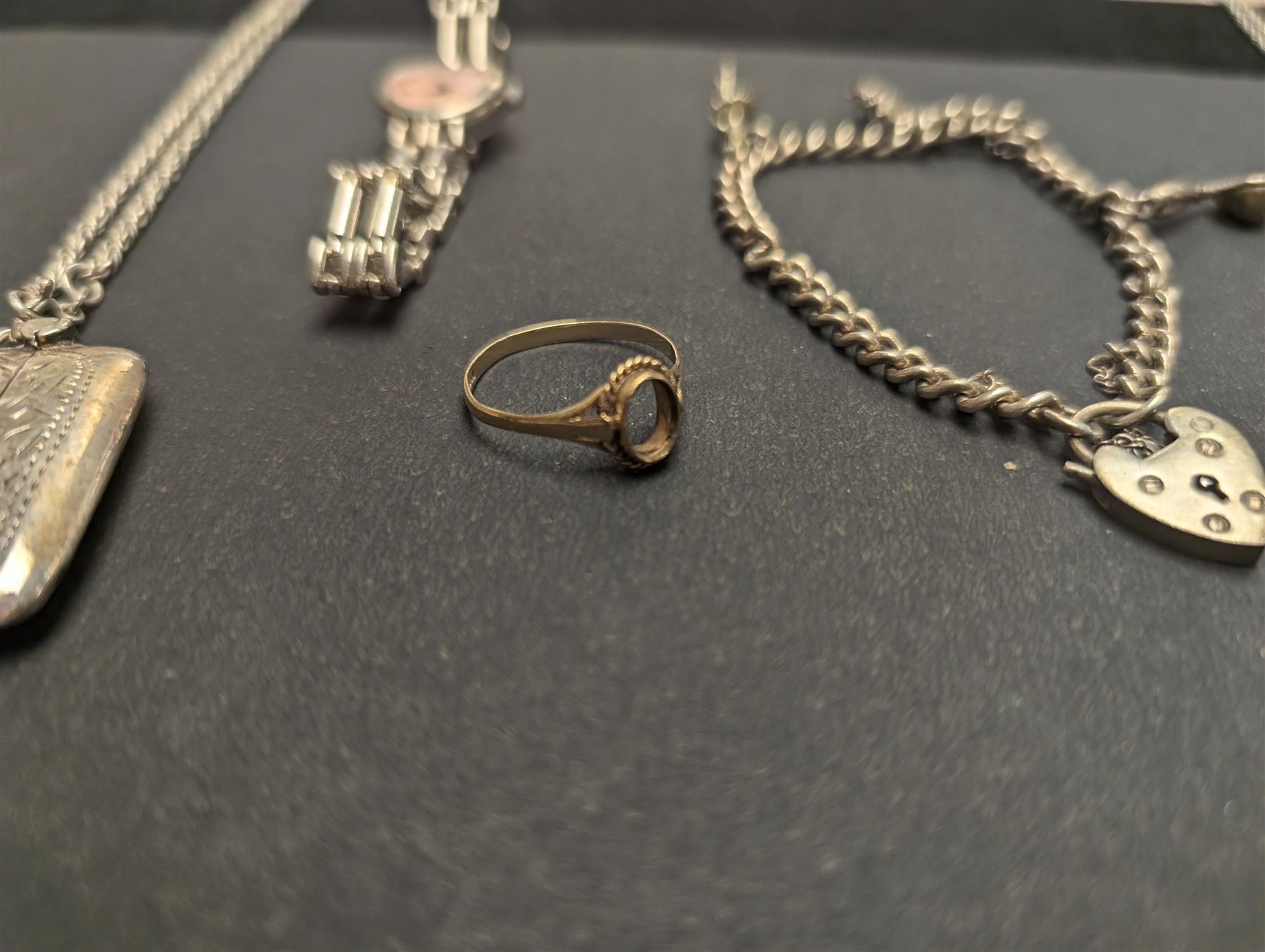 9ct gold ring shank and silver jewellery, including charm bracelet, locket necklace and a vesta case on chain, together with a rotary wristwatch